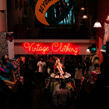 Neon sign in shop with vintage clothes